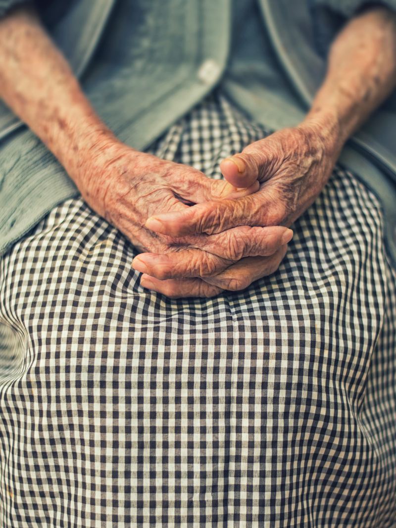 Geriatric physiotherapy — an elderly person's gently clasped hands